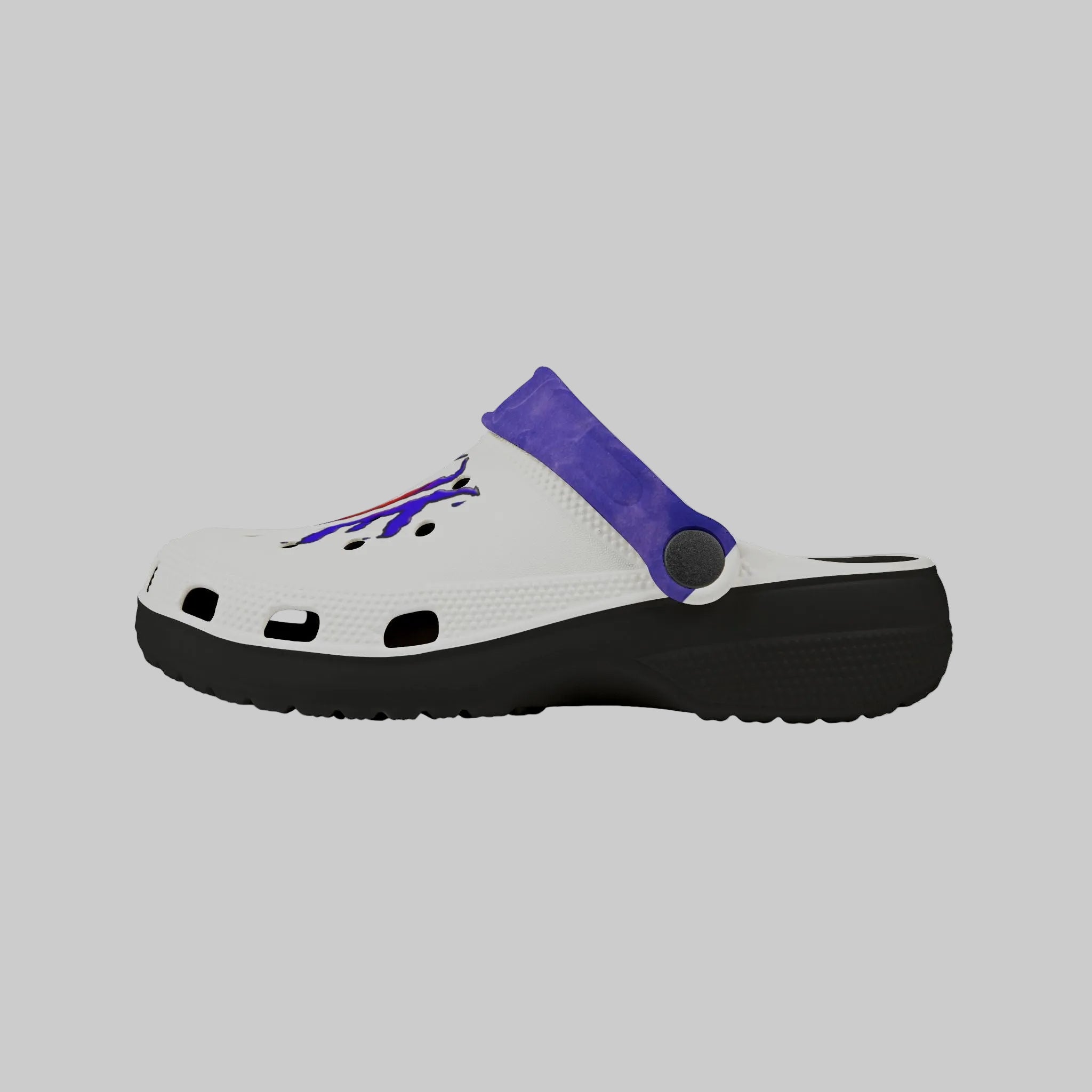 view of side of kid's clog to show footbed contour in black and breathability