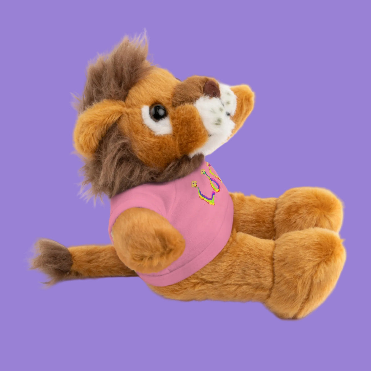 Plush lion toy wearing a pink shirt 