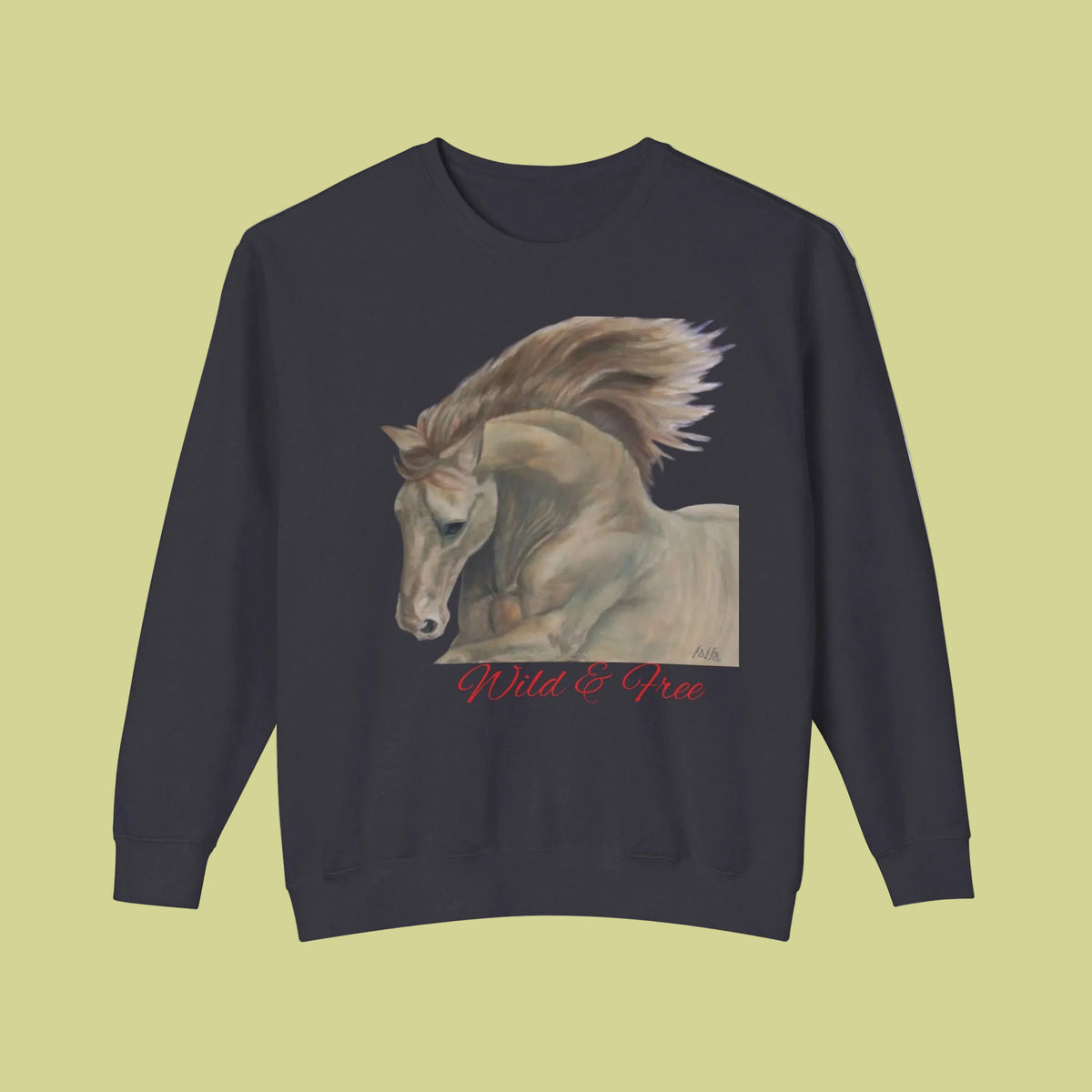 A Black crewneck sweatshirt featuring a graphic print of a light  horse with the text 'Wild & Free' in red cursive script below it with ribbed cuffs and hem.