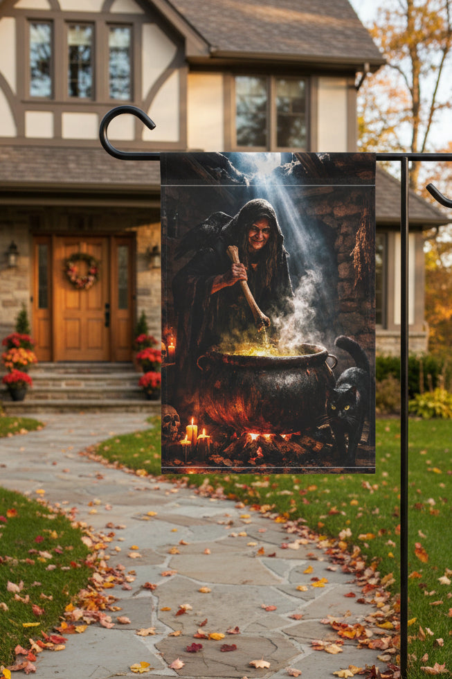 A vertical garden flag features a witch stirring a cauldron with a black cat beside it greets would be trick or treaters