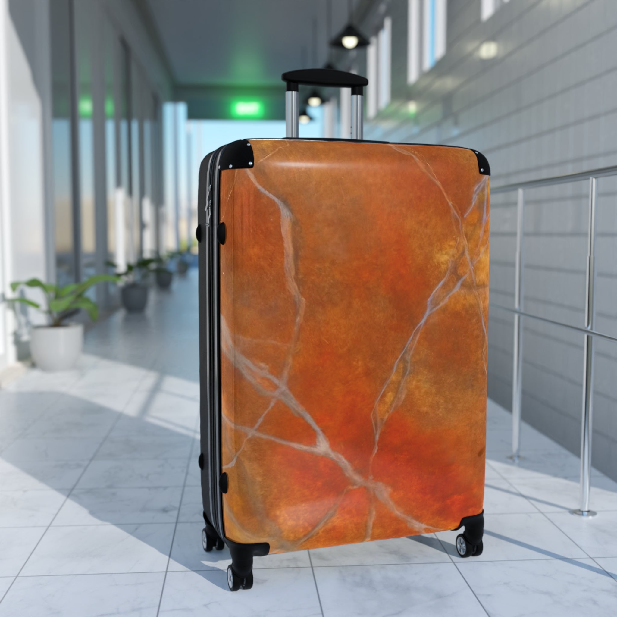 Orange marble-patterned suitcase available in small and medium