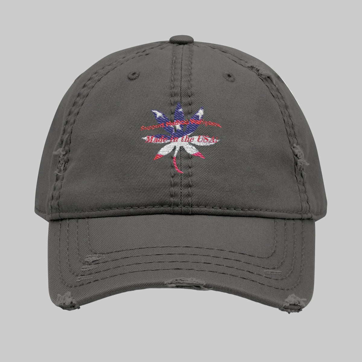 A distressed dark gray baseball cap featuring a central graphic of a cannabis leaf overlaid with the American flag and the text Support Medical Marijuana and Made in the USA looks cool and makes a statement.