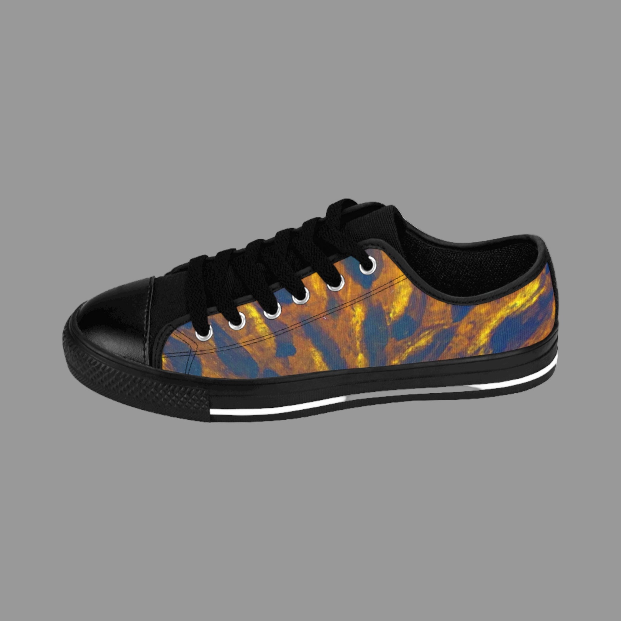 Black sneaker with a tiger stripe pattern on a white background