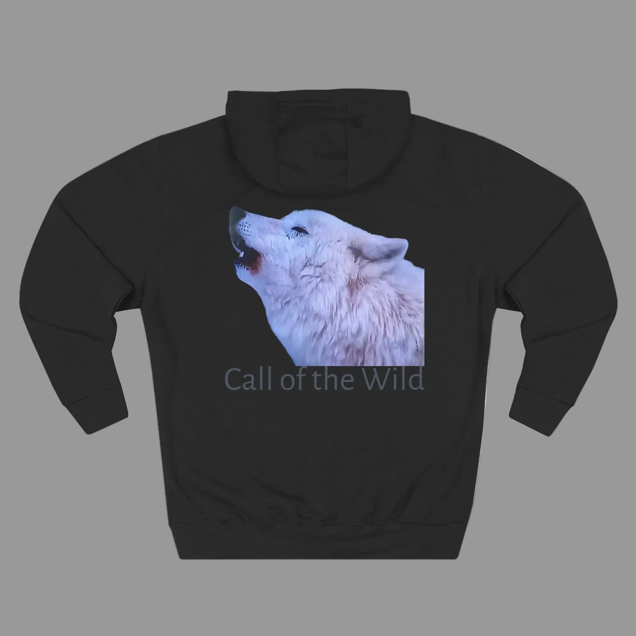 A black pullover hoodie shown from the back, featuring a graphic print of a white howling wolf with the text 'Call of the Wild' underneath - machine washable