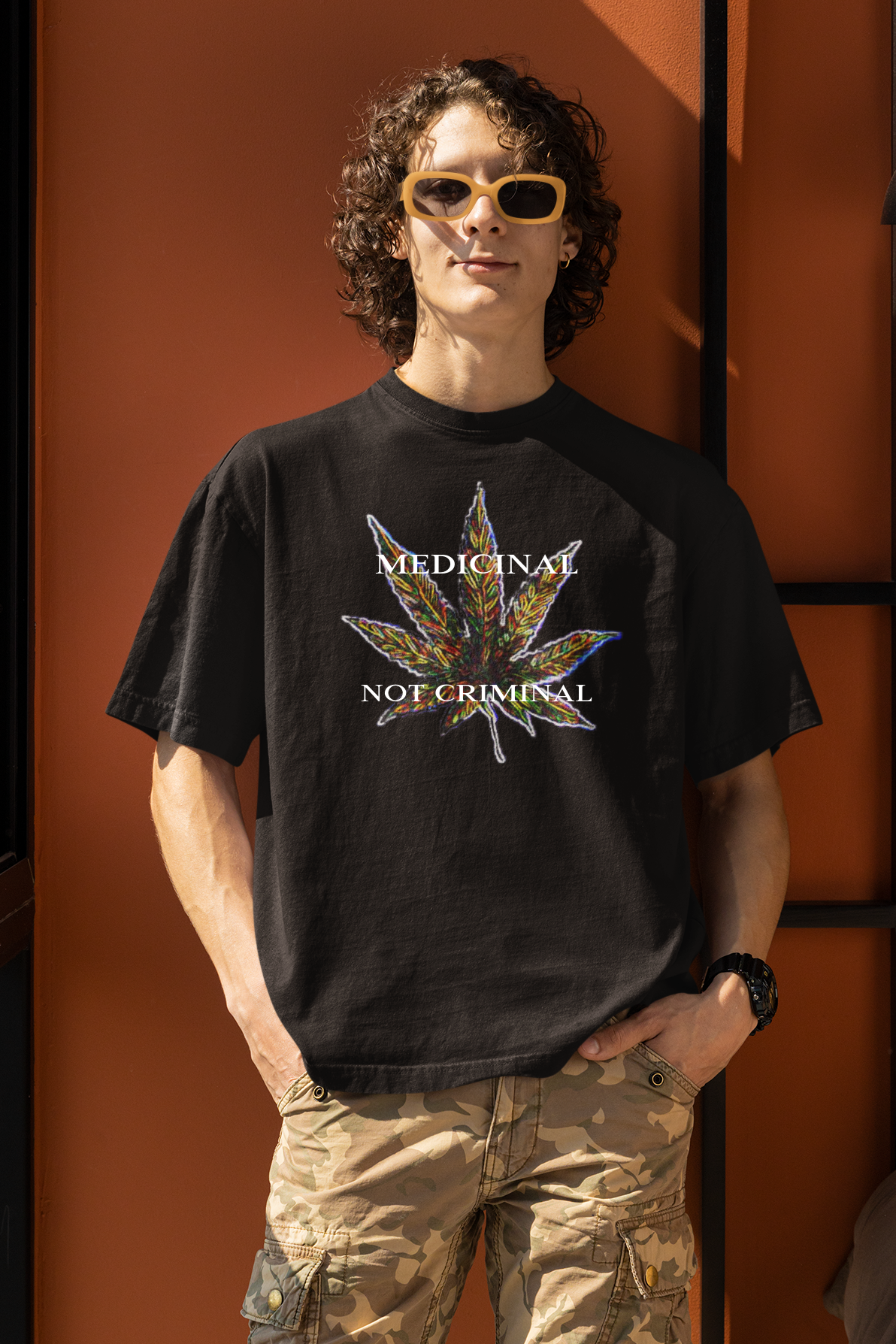 Unisex black ring-spun cotton t-shirt with a cannabis leaf design with Medicinal, Not Criminal