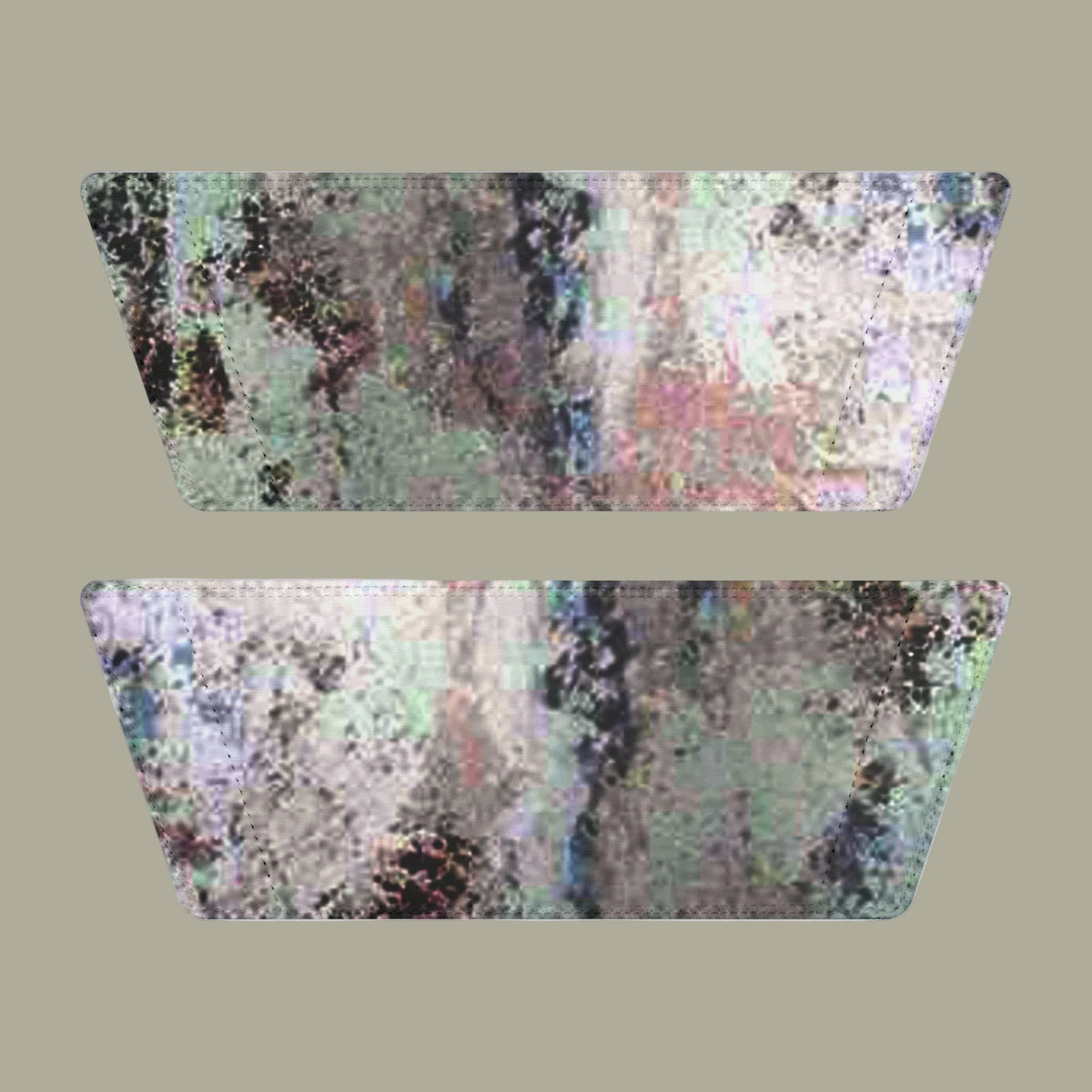 Two matching straps in an abstract, iridescent, pixelated pattern in shades of gray, green, pink, and purple that are removable and dries quickly