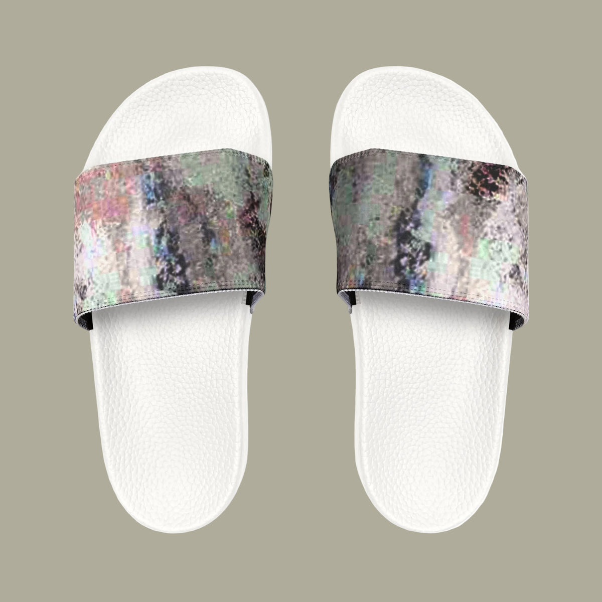 A pair of slide sandals with white textured footbeds and wide straps featuring an abstract, iridescent pattern in shades of gray, green, pink, and purple
