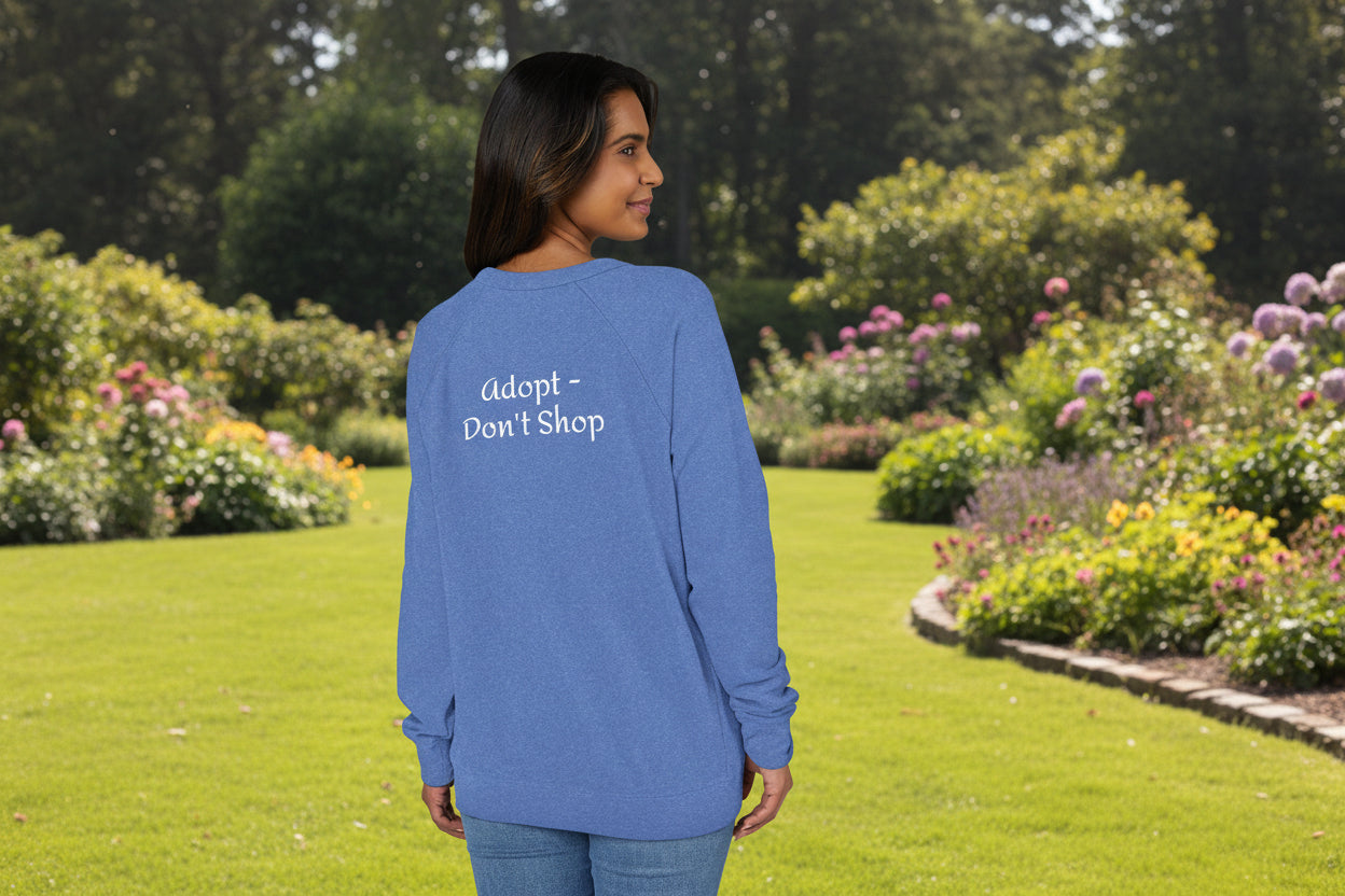 Person wearing a Heather Royal raglan shirt with 'adopt don't shop' text on the back to support dog rescue. S-3XL