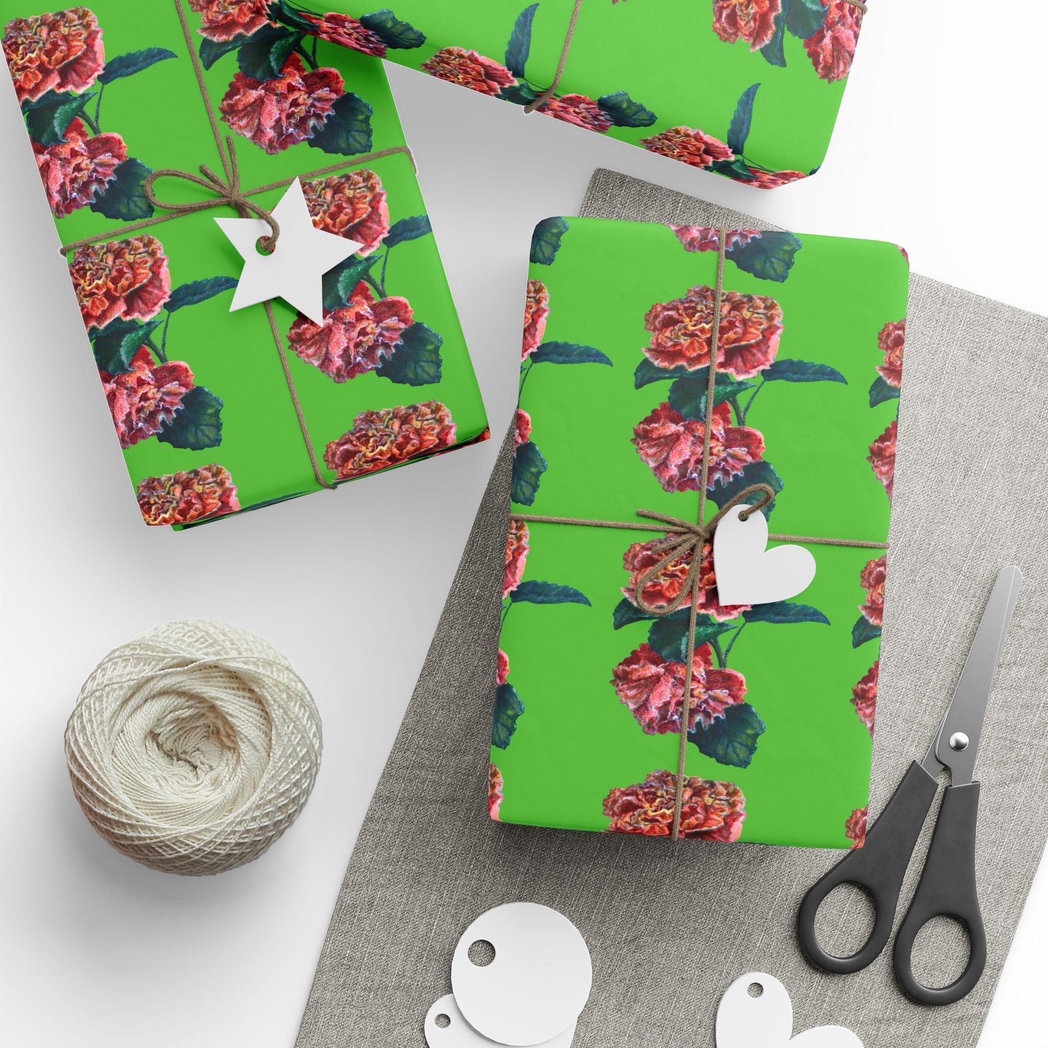 Two green floral gift boxes wrapped in custom hand painted floral pattern