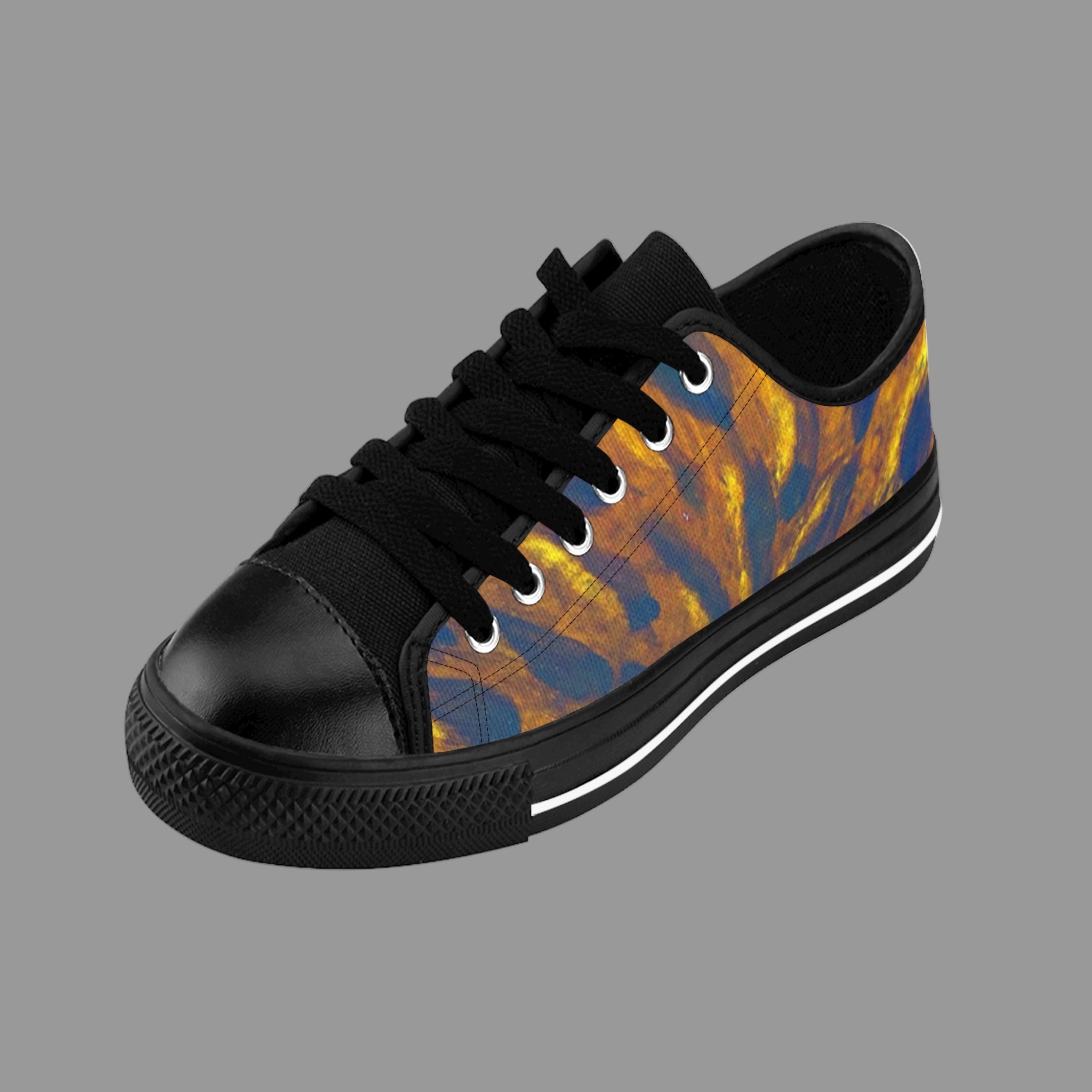 Black sneaker with a colorful pattern on a light background