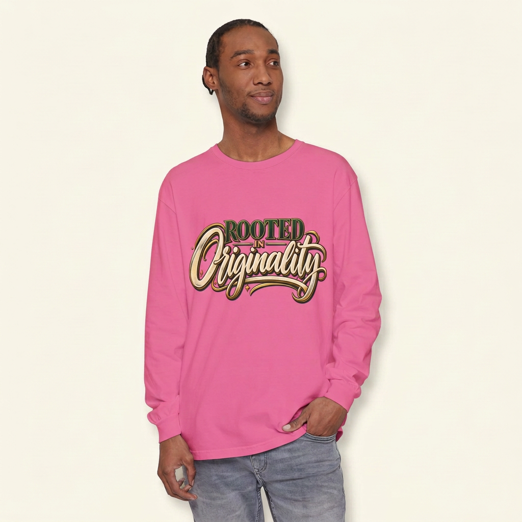 Man wearing a pink long-sleeve tee with green, cream and gold-look Rooted in Originality lettering.