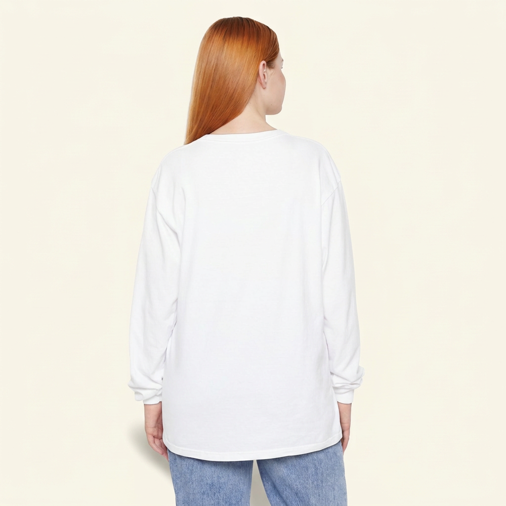 Back view of a red-haired woman wearing a plain white long-sleeve tee and blue jeans.