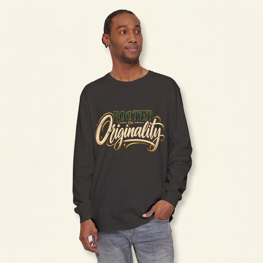 Man wearing a charcoal long-sleeve tee with green, cream and gold-look Rooted in Originality lettering.
