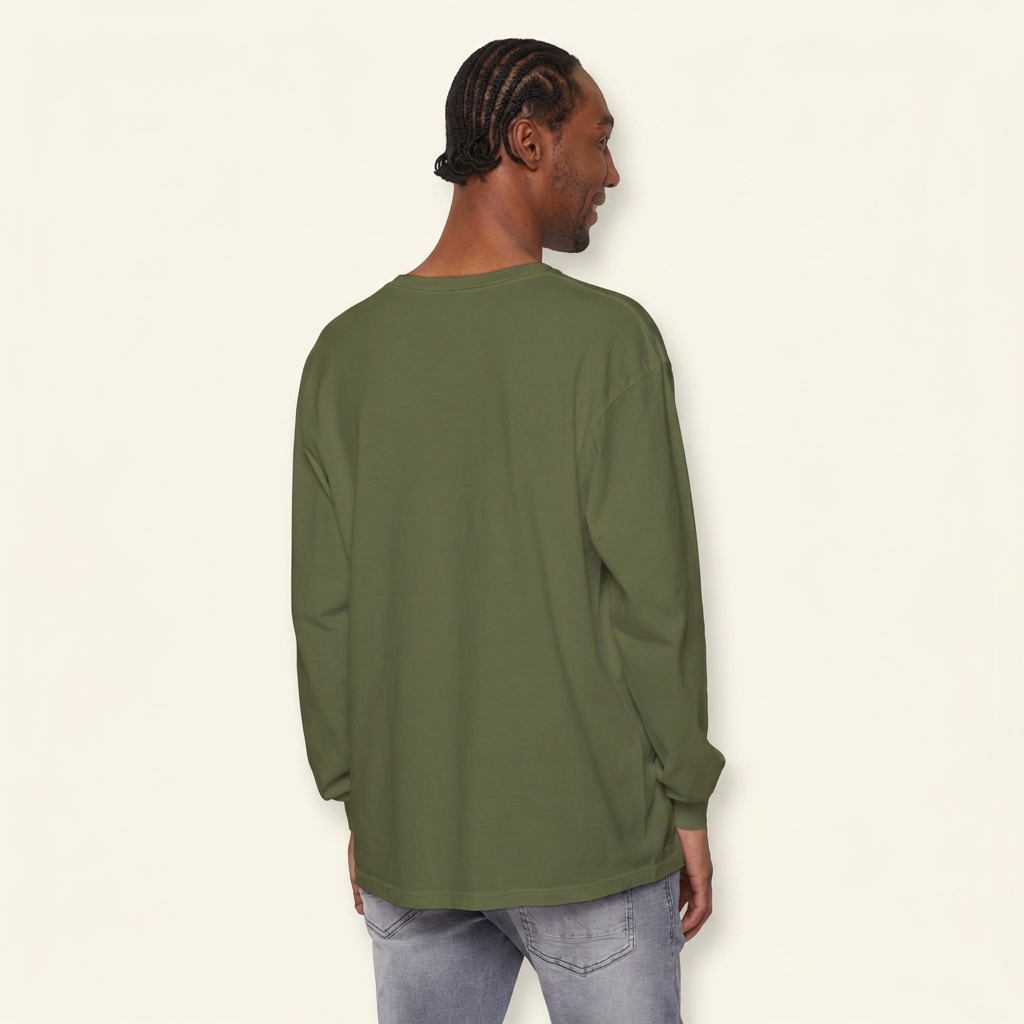 Back view of a man wearing a plain olive green long-sleeve tee and gray jeans.