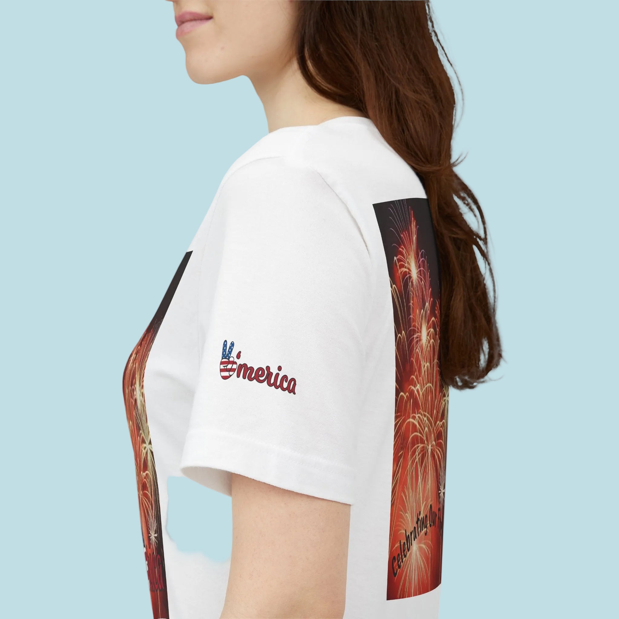 White t-shirt with colorful graphic design on sleeves and 'America' text