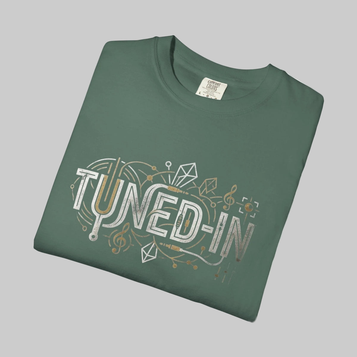 blue spruce tee folded with musical graphic