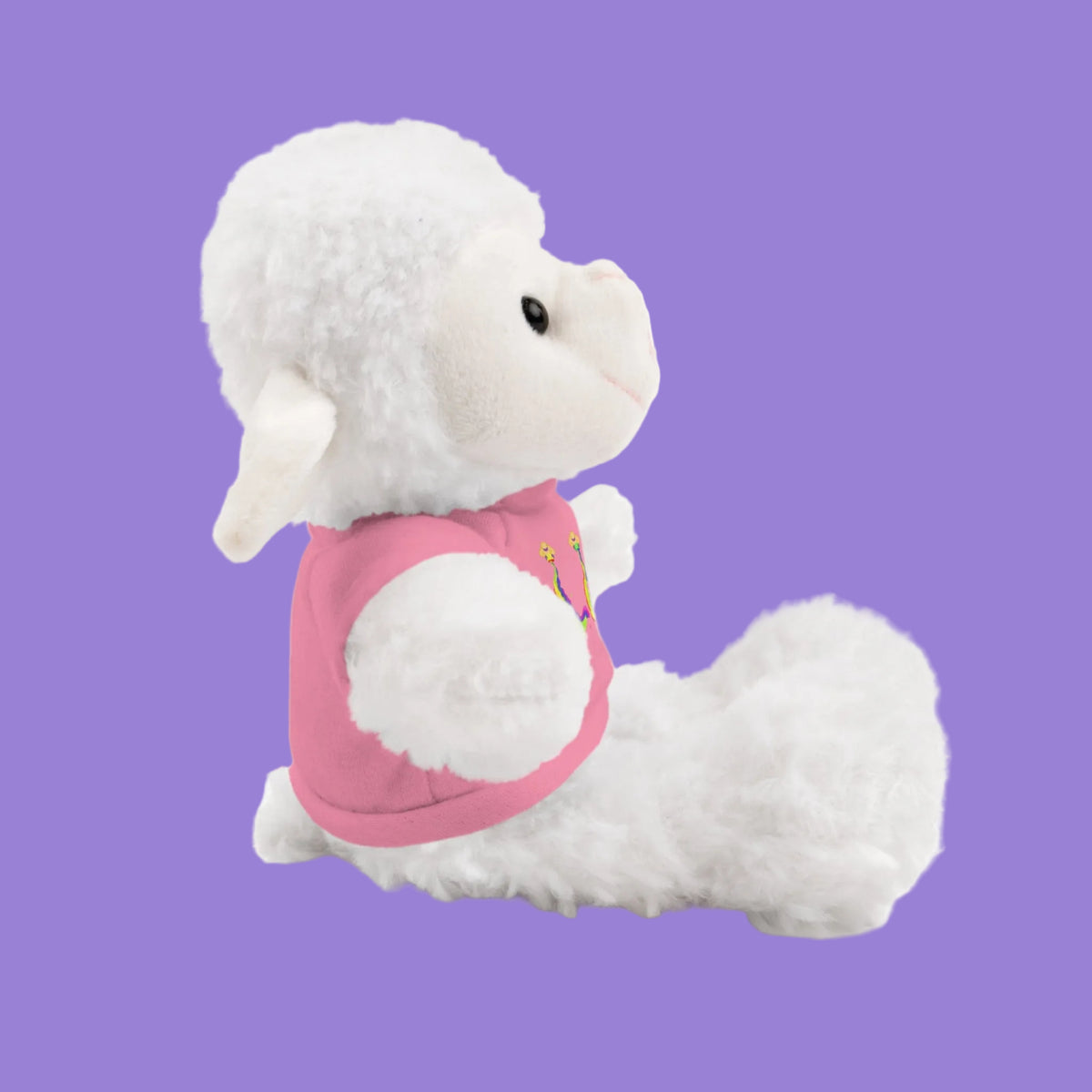 White plush lamb toy with a pink tee side view